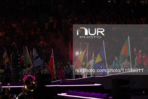 Flag bearers parade with their national flags during the closing ceremony on day eleven of the Paris 2024 Summer Paralympic Games at Stade d...