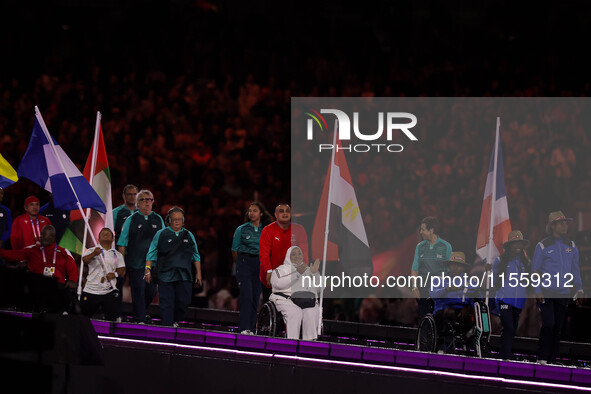 Flag bearers parade with their national flags during the closing ceremony on day eleven of the Paris 2024 Summer Paralympic Games at Stade d...