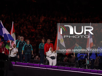 Flag bearers parade with their national flags during the closing ceremony on day eleven of the Paris 2024 Summer Paralympic Games at Stade d...