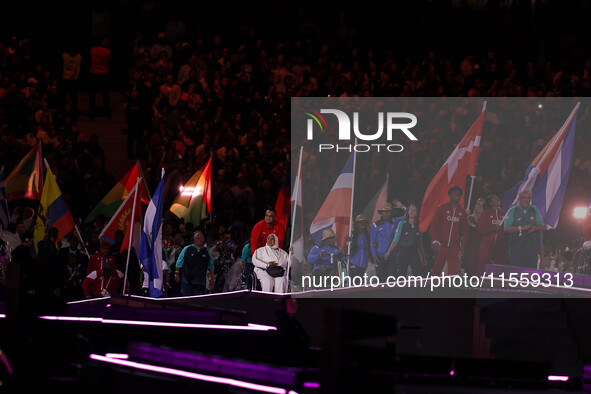 Flag bearers parade with their national flags during the closing ceremony on day eleven of the Paris 2024 Summer Paralympic Games at Stade d...