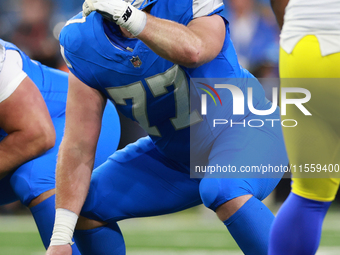 DETROIT,MICHIGAN-SEPTEMBER 8:  Center Frank Ragnow (77) of the Detroit Lions gestures as he prepares to snap the ball during a game between...