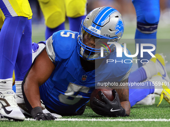 DETROIT,MICHIGAN-SEPTEMBER 8:  Running back David Montgomery (5) of the Detroit Lions holds the ball after being tackled during a game betwe...