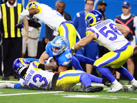 DETROIT,MICHIGAN-SEPTEMBER 8: Tight end Sam LaPorta (87) of the Detroit Lions is tackled by linebacker Christian Rozeboom (56) of the Los An...