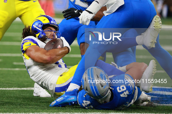 DETROIT,MICHIGAN-SEPTEMBER 8: Los Angeles Rams wide receiver Puka Nacua (17) is tackled by Detroit Lions linebacker Jack Campbell (46) durin...