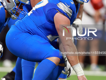 DETROIT,MICHIGAN-SEPTEMBER 8:  Center Frank Ragnow (77) of the Detroit Lions prepares to snap the ball during a game between the Detroit Lio...