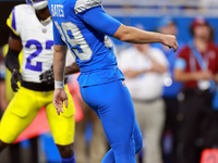 DETROIT,MICHIGAN-SEPTEMBER 8:  Detroit Lions kicker Jake Bates (39) follows his field goal kick during a game between the Detroit Lions and...