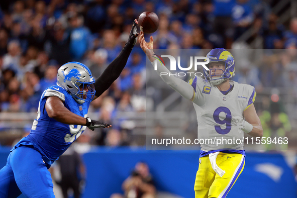 DETROIT,MICHIGAN-SEPTEMBER 8:  Quarterback Matthew Stafford (9) of the Los Angeles Rams pass is blockedl by defensive end Marcus Davenport (...