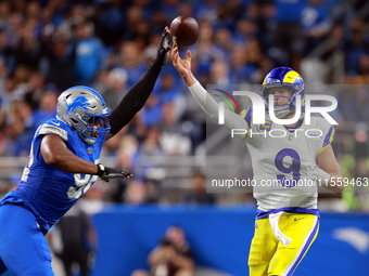 DETROIT,MICHIGAN-SEPTEMBER 8:  Quarterback Matthew Stafford (9) of the Los Angeles Rams pass is blockedl by defensive end Marcus Davenport (...