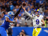 DETROIT,MICHIGAN-SEPTEMBER 8:  Quarterback Matthew Stafford (9) of the Los Angeles Rams pass is blockedl by defensive end Marcus Davenport (...