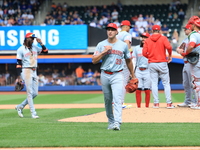 Cincinnati Reds pitcher Julian Aguiar #39 leaves the game during the fifth inning of the baseball game against the New York Mets at Citi Fie...