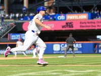 Pete Alonso #20 of the New York Mets scores from second base during the sixth inning of the baseball game against the Cincinnati Reds at Cit...