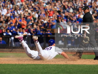 Pete Alonso #20 of the New York Mets scores from second base during the sixth inning of the baseball game against the Cincinnati Reds at Cit...