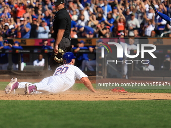 Pete Alonso #20 of the New York Mets scores from second base during the sixth inning of the baseball game against the Cincinnati Reds at Cit...