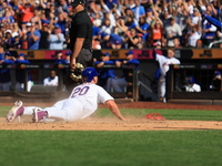 Pete Alonso #20 of the New York Mets scores from second base during the sixth inning of the baseball game against the Cincinnati Reds at Cit...