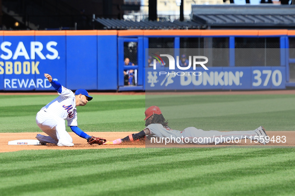 Cincinnati Reds' Elly De La Cruz #44 is caught stealing during the fourth inning of the baseball game against the New York Mets at Citi Fiel...