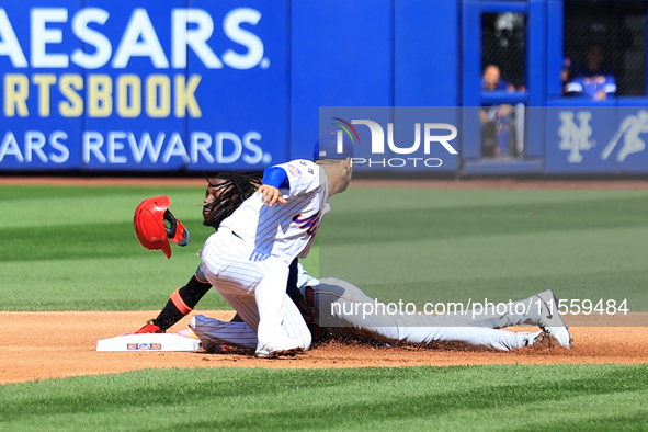 Cincinnati Reds' Elly De La Cruz #44 is caught stealing during the fourth inning of the baseball game against the New York Mets at Citi Fiel...