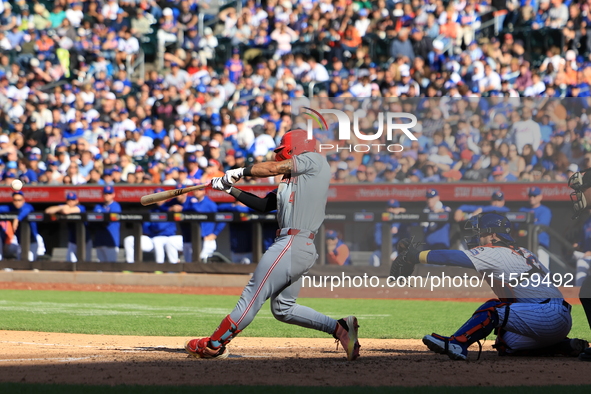 Cincinnati Reds' Santiago Espinal #4 doubles during the ninth inning of the baseball game against the New York Mets at Citi Field in Corona,...