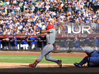 Cincinnati Reds' Santiago Espinal #4 doubles during the ninth inning of the baseball game against the New York Mets at Citi Field in Corona,...