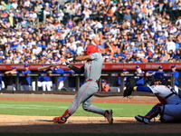 Cincinnati Reds' Santiago Espinal #4 doubles during the ninth inning of the baseball game against the New York Mets at Citi Field in Corona,...