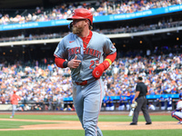 Jake Fraley #27 of the Cincinnati Reds is congratulated after scoring during the seventh inning of the baseball game against the New York Me...