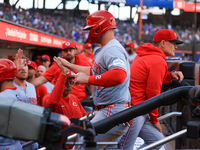 Cincinnati Reds' Ty France #2 heads towards the dugout after scoring during the ninth inning of the baseball game against the New York Mets...