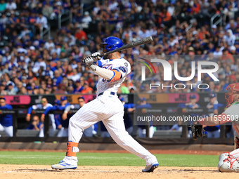 New York Mets' Starling Marte #6 singles during the sixth inning of the baseball game against the Cincinnati Reds at Citi Field in Corona, N...