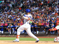 New York Mets' Starling Marte #6 singles during the sixth inning of the baseball game against the Cincinnati Reds at Citi Field in Corona, N...