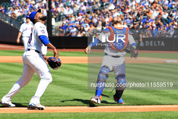 New York Mets catcher Luis Torrens #13 makes a catch during the fourth inning of the baseball game against the Cincinnati Reds at Citi Field...