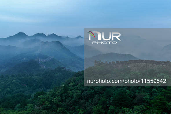 Clouds linger over the Jinshanling Great Wall after rain in Chengde, China, on September 8, 2024. 