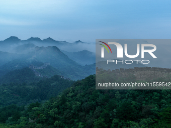 Clouds linger over the Jinshanling Great Wall after rain in Chengde, China, on September 8, 2024. (