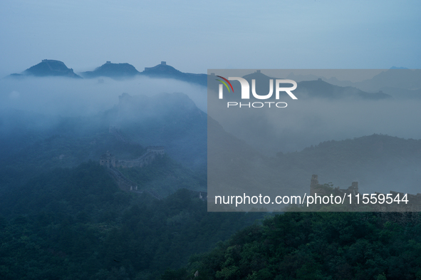 Clouds linger over the Jinshanling Great Wall after rain in Chengde, China, on September 8, 2024. 