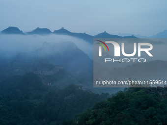 Clouds linger over the Jinshanling Great Wall after rain in Chengde, China, on September 8, 2024. (