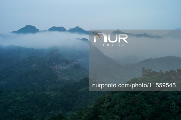 Clouds linger over the Jinshanling Great Wall after rain in Chengde, China, on September 8, 2024. 