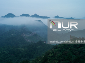 Clouds linger over the Jinshanling Great Wall after rain in Chengde, China, on September 8, 2024. (