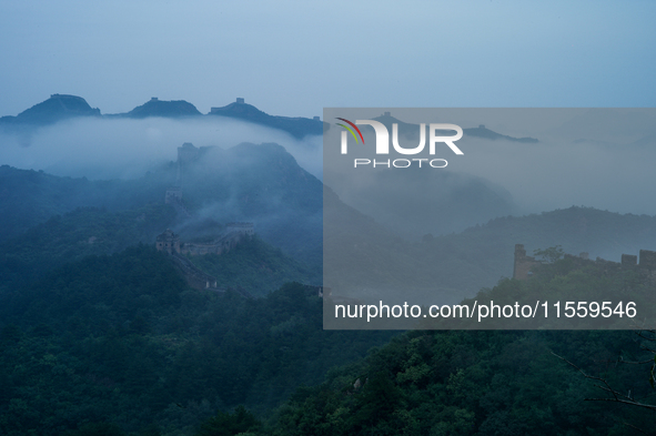 Clouds linger over the Jinshanling Great Wall after rain in Chengde, China, on September 8, 2024. 