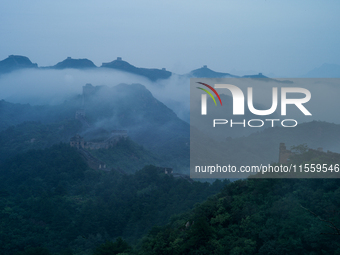 Clouds linger over the Jinshanling Great Wall after rain in Chengde, China, on September 8, 2024. (