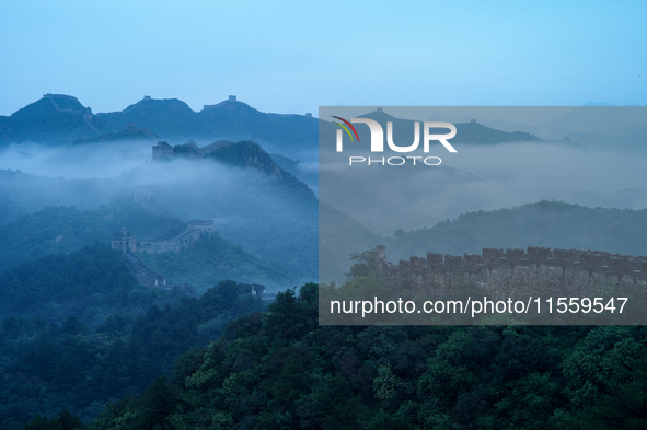 Clouds linger over the Jinshanling Great Wall after rain in Chengde, China, on September 8, 2024. 