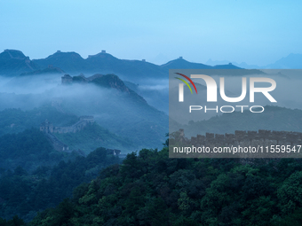 Clouds linger over the Jinshanling Great Wall after rain in Chengde, China, on September 8, 2024. (