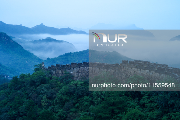 Clouds linger over the Jinshanling Great Wall after rain in Chengde, China, on September 8, 2024. 