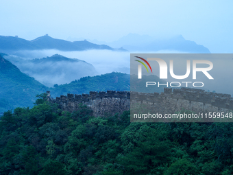 Clouds linger over the Jinshanling Great Wall after rain in Chengde, China, on September 8, 2024. (