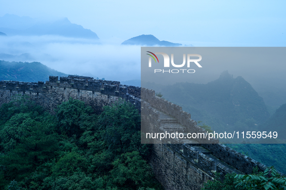 Clouds linger over the Jinshanling Great Wall after rain in Chengde, China, on September 8, 2024. 