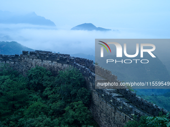 Clouds linger over the Jinshanling Great Wall after rain in Chengde, China, on September 8, 2024. (