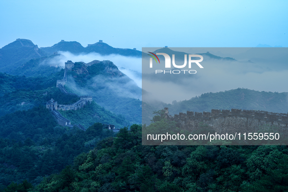 Clouds linger over the Jinshanling Great Wall after rain in Chengde, China, on September 8, 2024. 