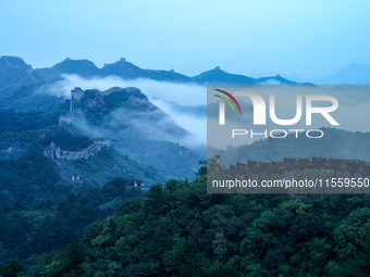 Clouds linger over the Jinshanling Great Wall after rain in Chengde, China, on September 8, 2024. (