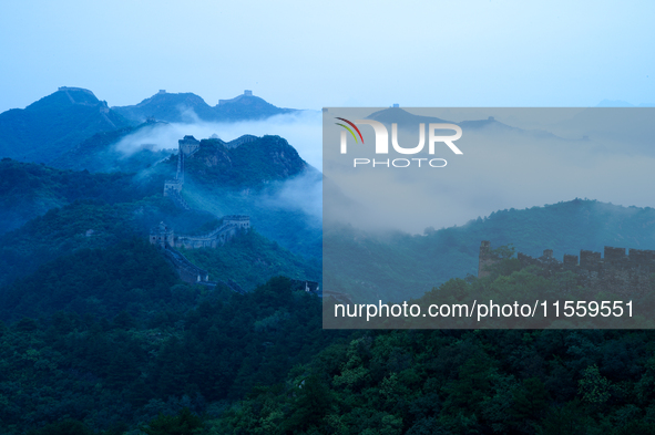 Clouds linger over the Jinshanling Great Wall after rain in Chengde, China, on September 8, 2024. 