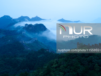 Clouds linger over the Jinshanling Great Wall after rain in Chengde, China, on September 8, 2024. (