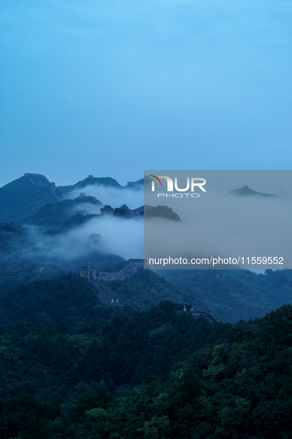 Clouds linger over the Jinshanling Great Wall after rain in Chengde, China, on September 8, 2024. 