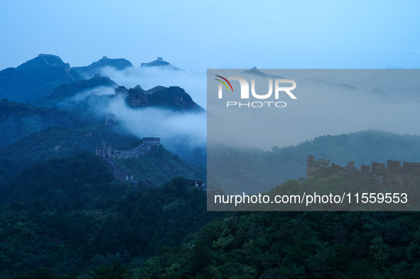 Clouds linger over the Jinshanling Great Wall after rain in Chengde, China, on September 8, 2024. 