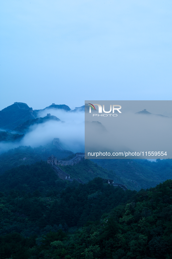 Clouds linger over the Jinshanling Great Wall after rain in Chengde, China, on September 8, 2024. 