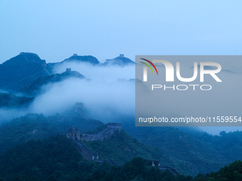 Clouds linger over the Jinshanling Great Wall after rain in Chengde, China, on September 8, 2024. (